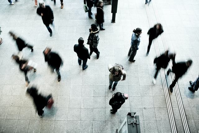 Birdseye of city crowd walking on sidewalk